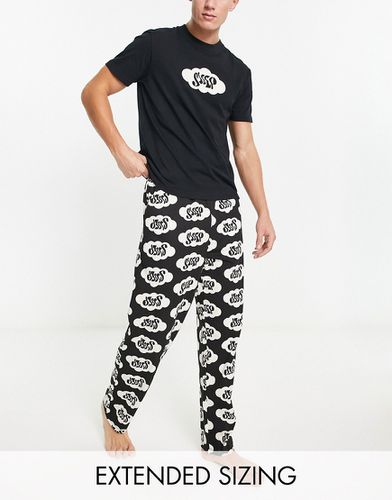 Pigiama nero con stampa "Sleep" composto da T-shirt e pantaloni - ASOS DESIGN - Modalova