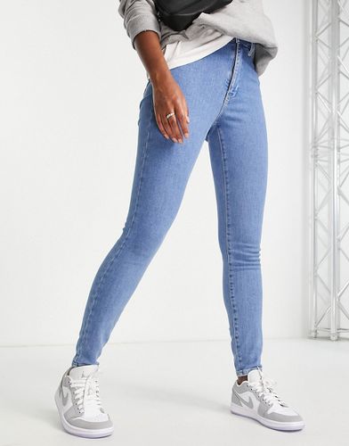 Sylvia - Jeans super skinny a vita alta lavaggio medio-Blu - Tommy Jeans - Modalova