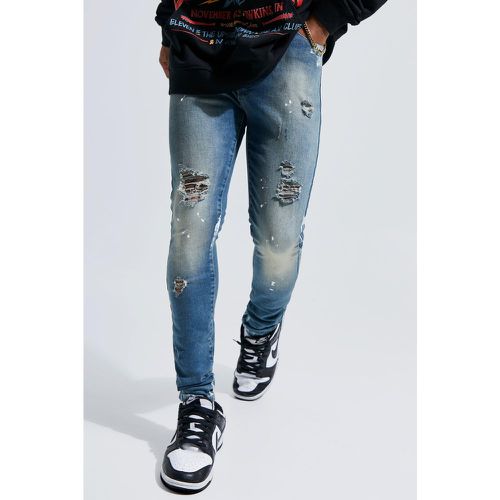 Jeans Super Skinny Fit strappati con schizzi di colore - boohoo - Modalova